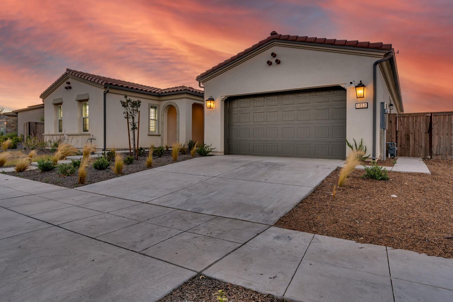 1053 Beaver Pond Loop Madera, CA 93636 - Photo 3 of 81 a front view of a house with a yard