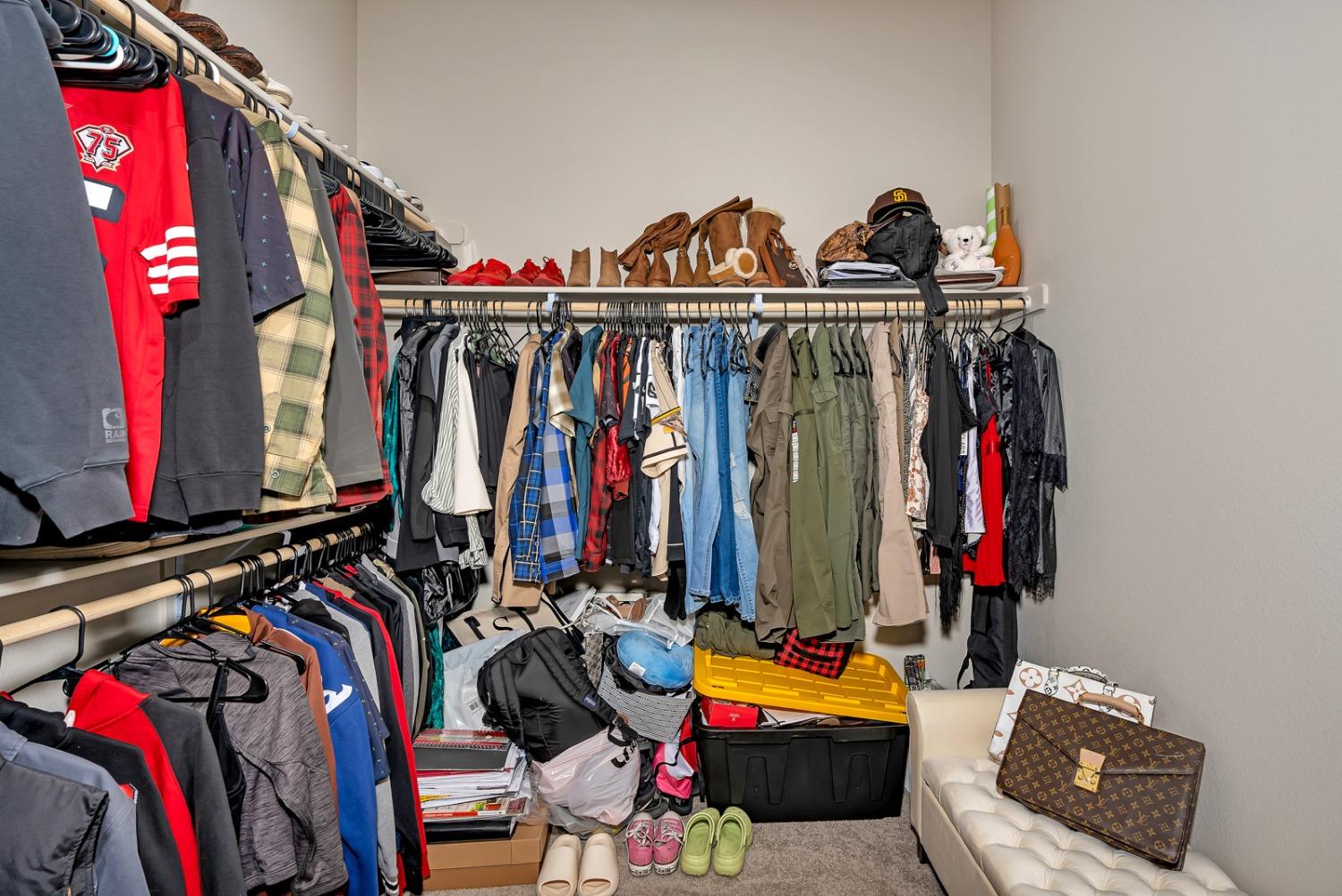 1053 Beaver Pond Loop Madera, CA 93636 - Photo 31 of 81 a view of walk in closet with clothes
