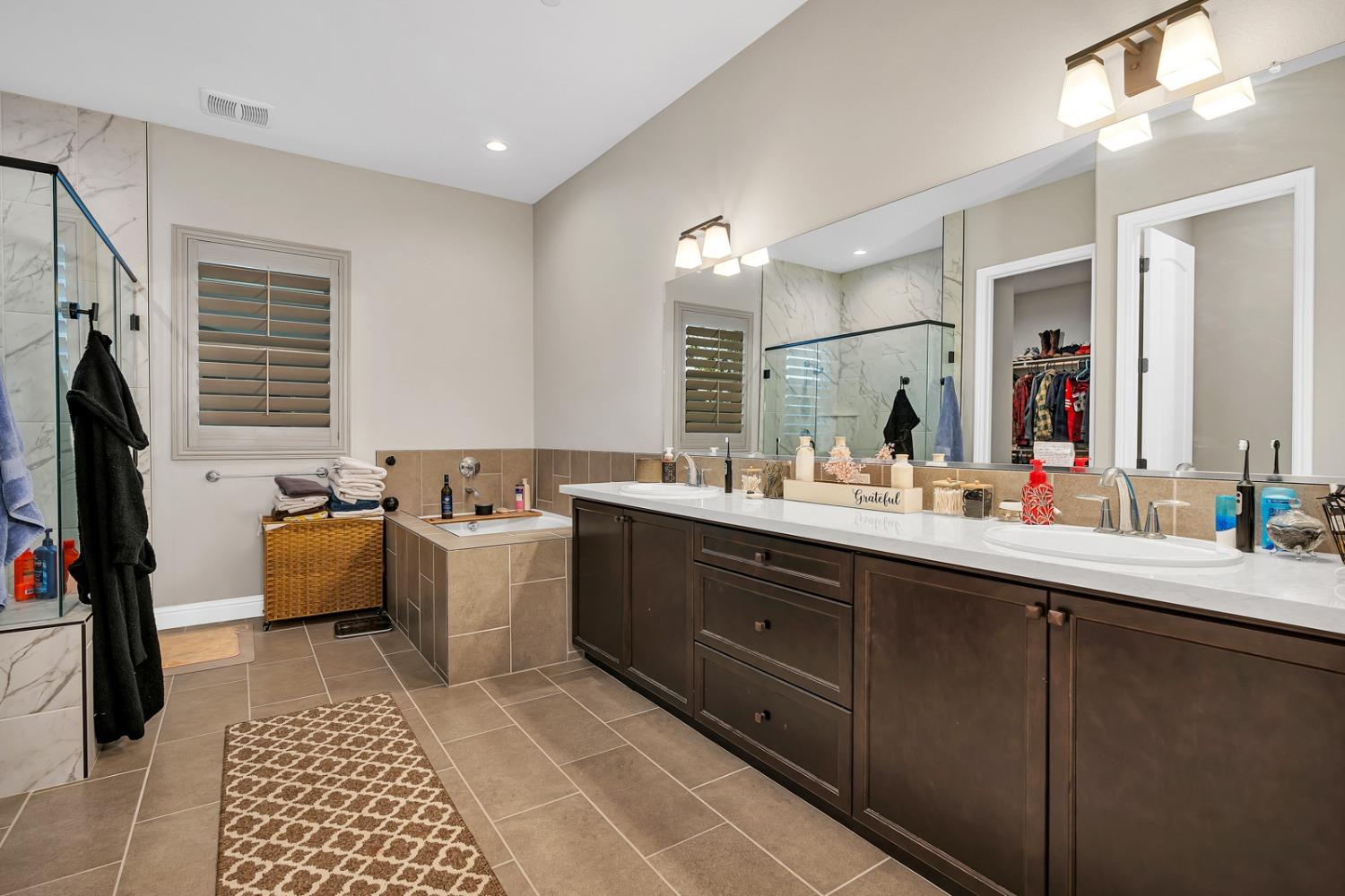 1053 Beaver Pond Loop Madera, CA 93636 - Photo 32 of 81 a kitchen with a sink cabinets and appliances