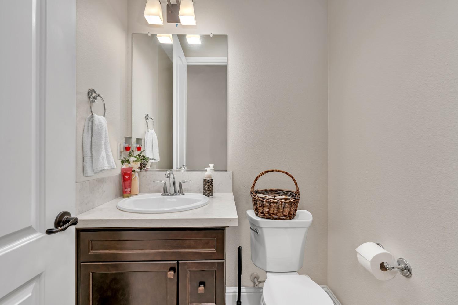 1053 Beaver Pond Loop Madera, CA 93636 - Photo 37 of 81 a bathroom with a sink and a toilet