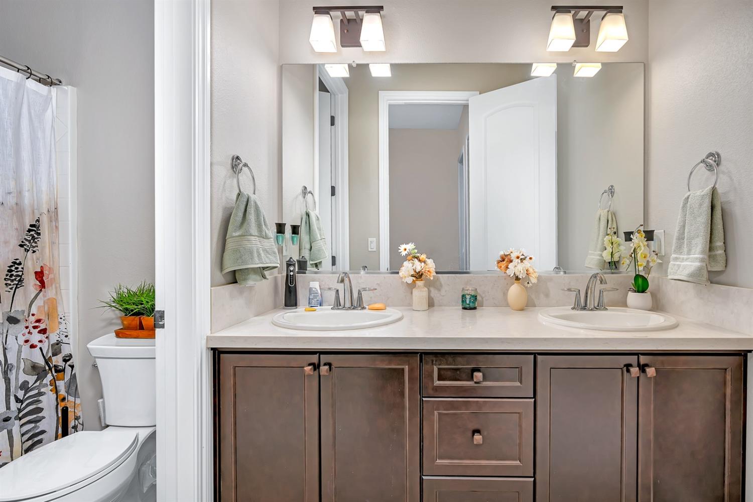 1053 Beaver Pond Loop Madera, CA 93636 - Photo 41 of 81 a bathroom with a sink vanity granite and toilet