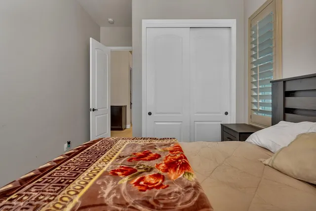 a living room with furniture pool table and chairs