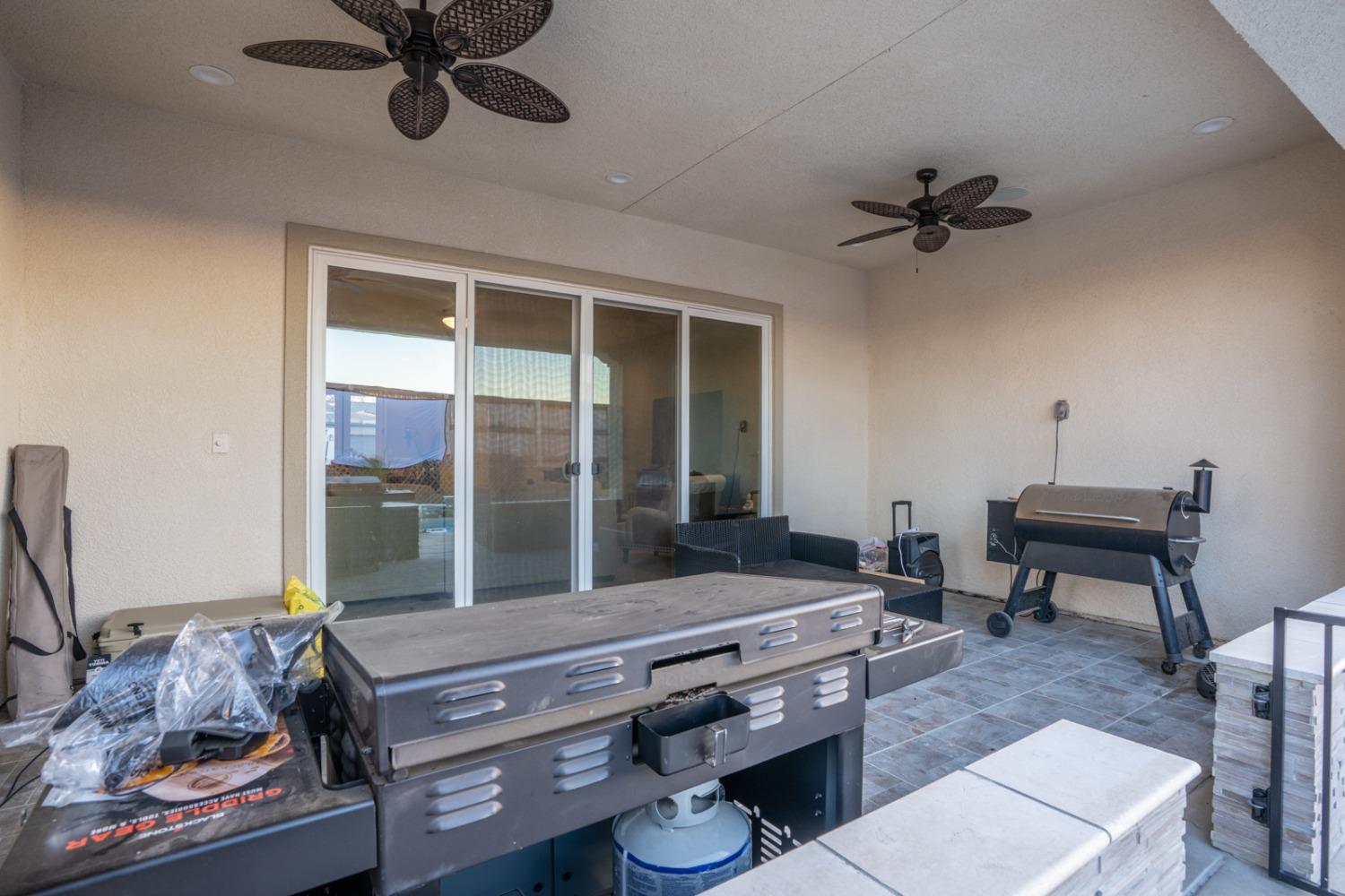 1053 Beaver Pond Loop Madera, CA 93636 - Photo 55 of 81 a living room with furniture and a window