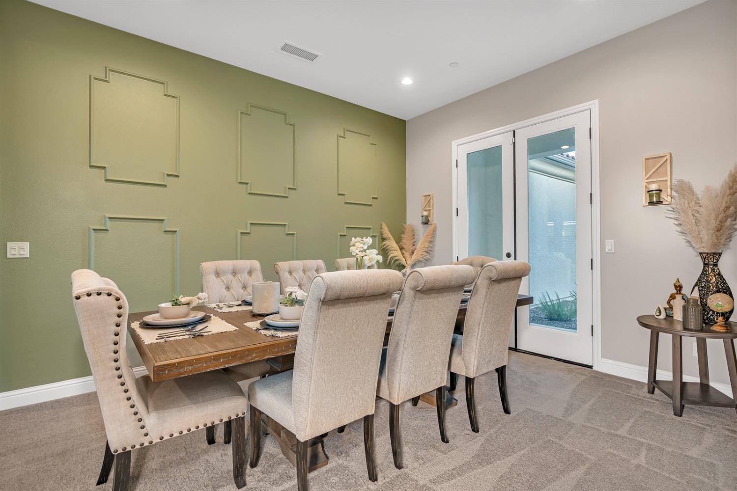 1053 Beaver Pond Loop Madera, CA 93636 - Photo 6 of 81 a view of a dining room with furniture and a chandelier