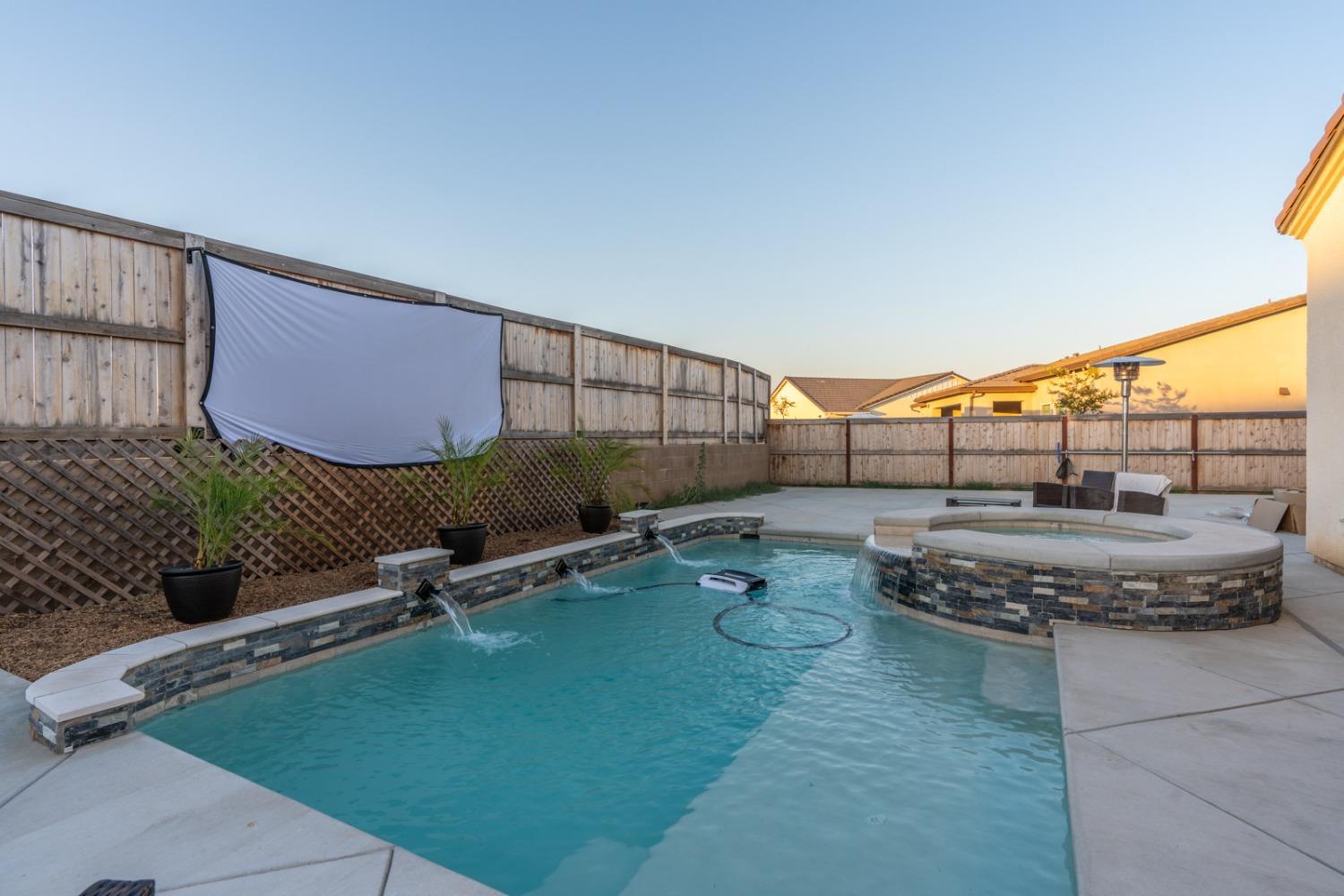 1053 Beaver Pond Loop Madera, CA 93636 - Photo 62 of 81 a view of a swimming pool with outdoor seating
