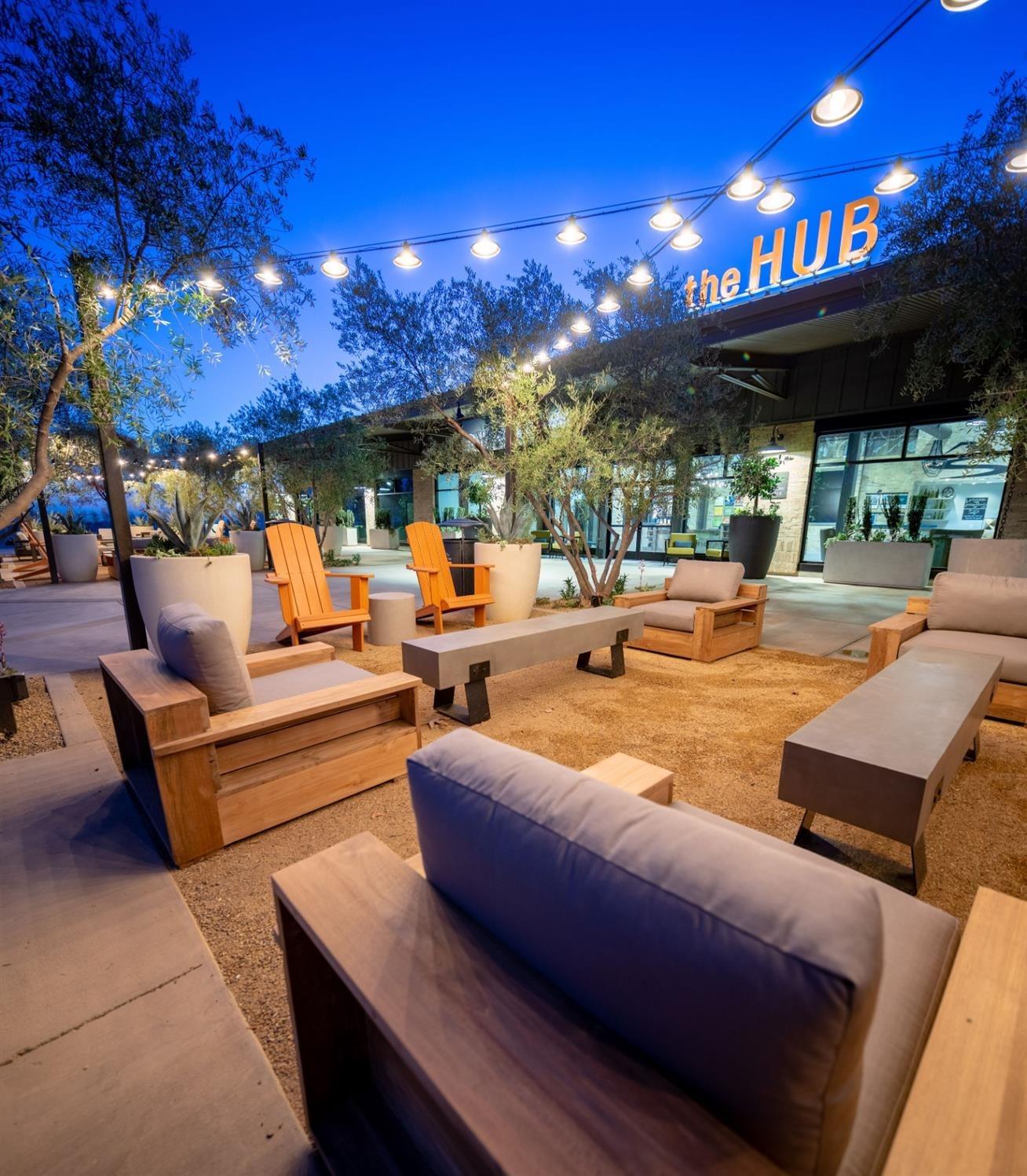 1053 Beaver Pond Loop Madera, CA 93636 - Photo 76 of 81 a outdoor space with patio furniture and a fireplace