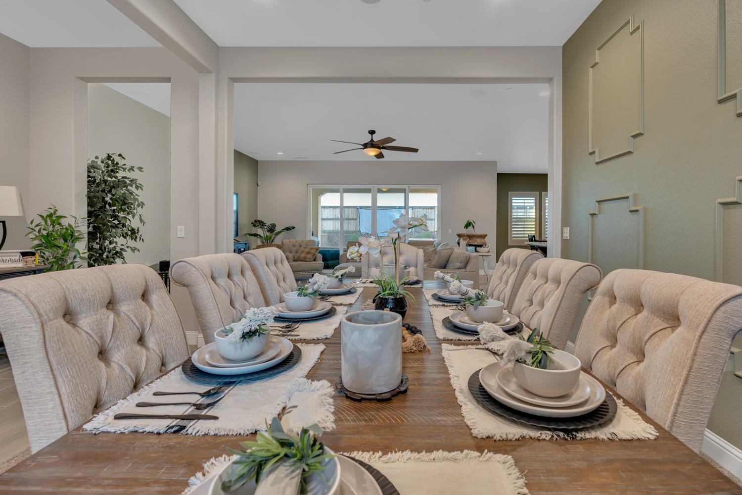 1053 Beaver Pond Loop Madera, CA 93636 - Photo 9 of 81 a living room with furniture and a large mirror