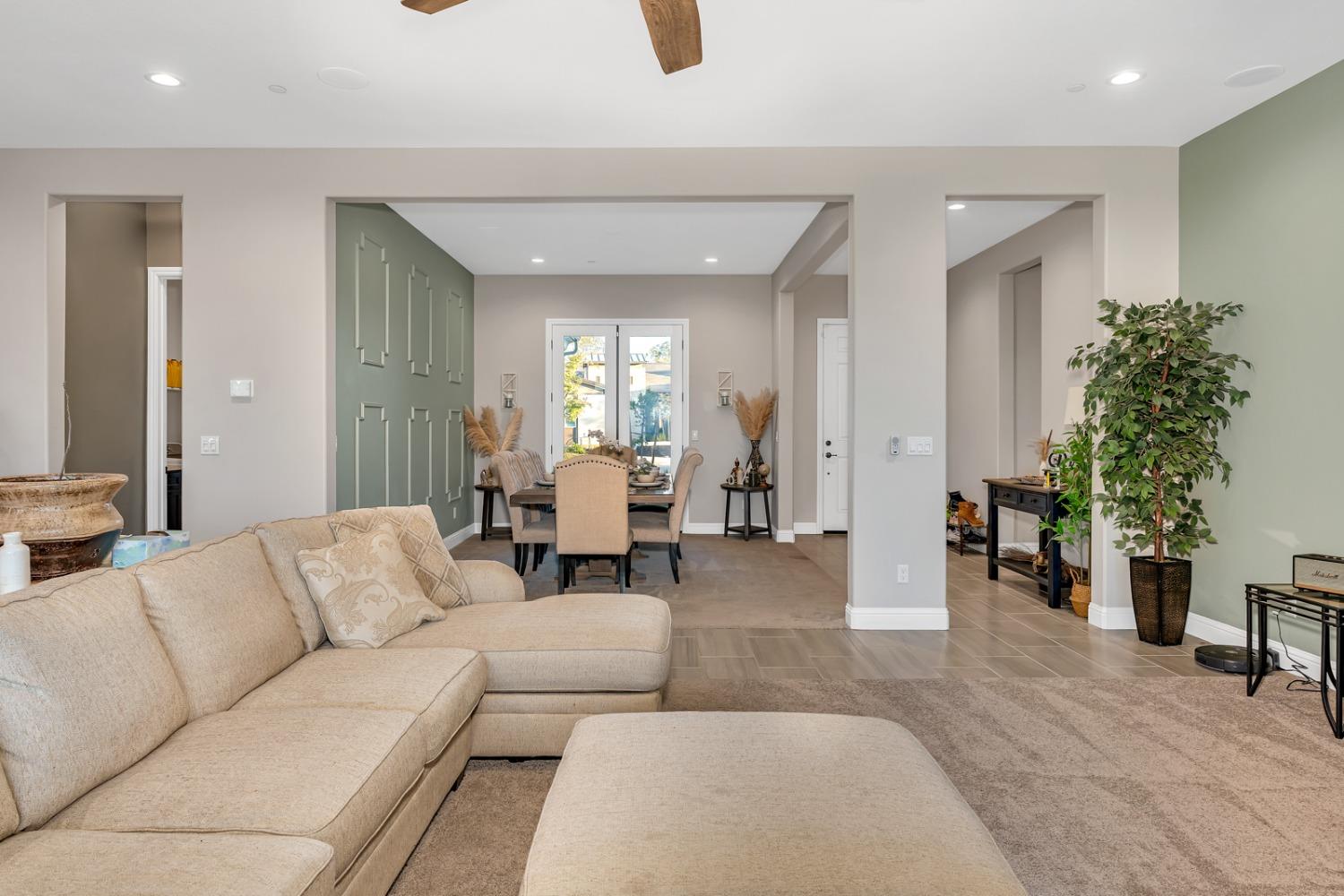 1053 Beaver Pond Loop Madera, CA 93636 - Photo 10 of 81 a living room with furniture and a potted plant