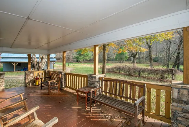 a view of a chairs and table in patio