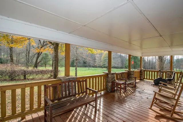 a view of balcony with chairs and wooden floor