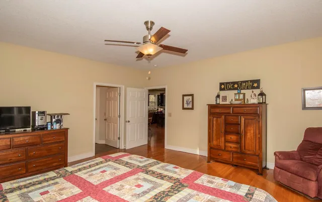 a bedroom with a bed and furniture