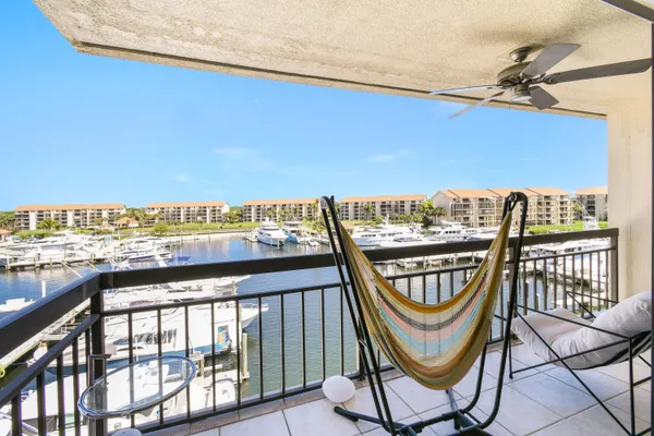 a view of a balcony with chairs