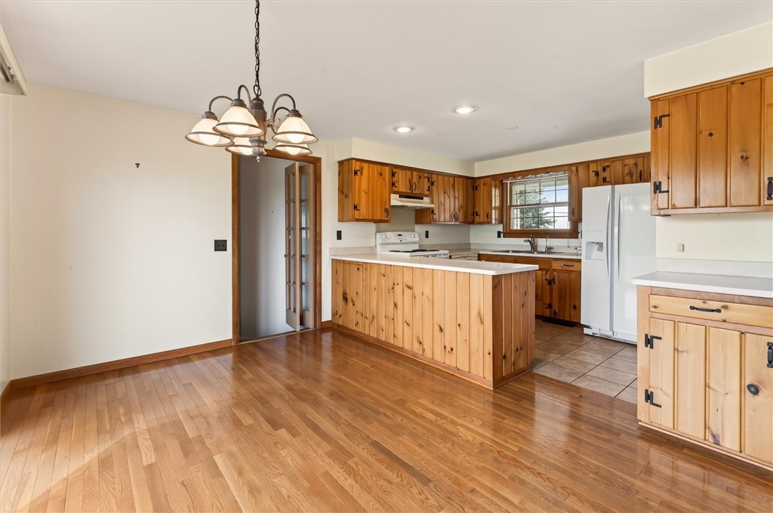 6404 Shaker Tract Road Huron, NY 14516 - Photo 20 of 49 dining area and kitchen