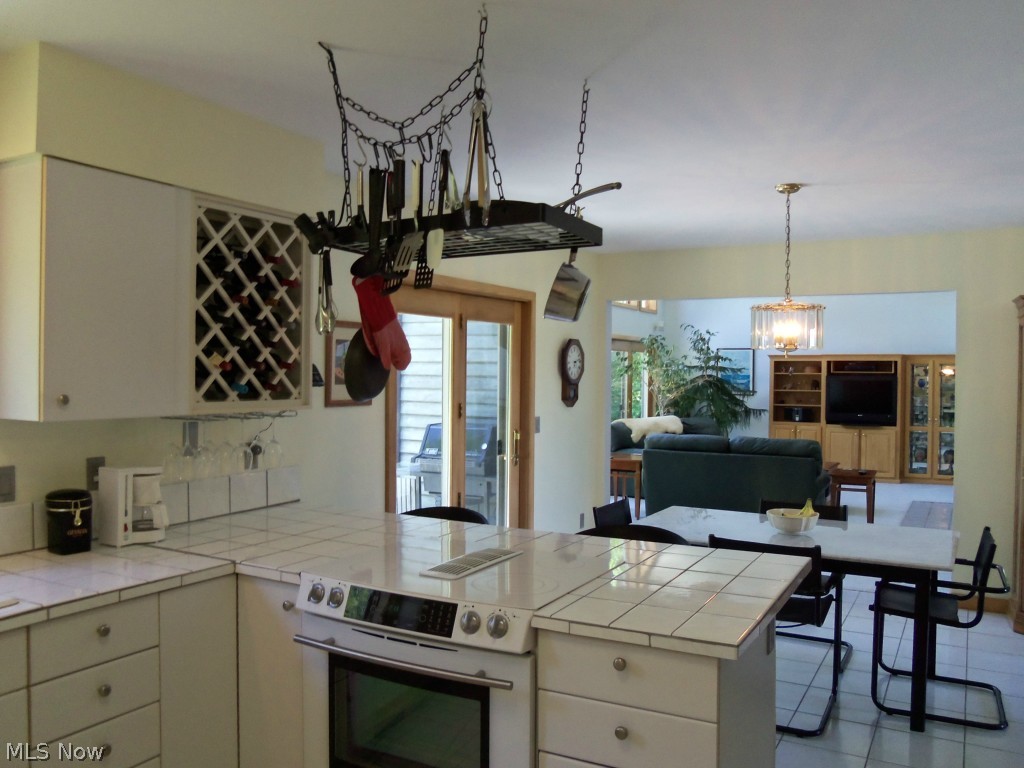 2201 Bennett Road Madison, OH 44057 - Photo 25 of 25 THE "COOK" IN THE FAMILY WILL NEVER FEEL ISOLATED FROM THE ACTIVITY IN THE GREAT ROOM WITH THIS OPEN AND FLOWING FLOOR PLAN.