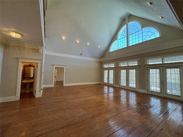 a view of an entryway with wooden floor
