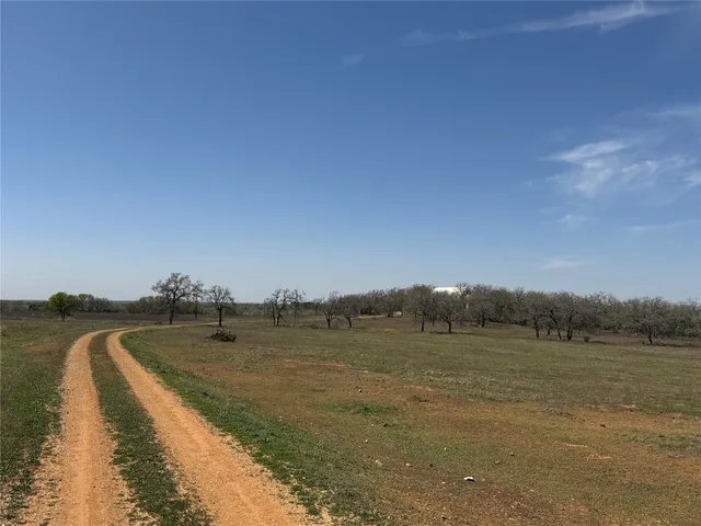 a view of a lake with houses in the back