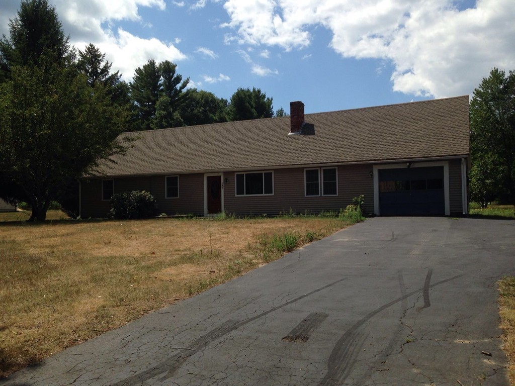 132 Benjamin Road Shirley, MA 01464 - Photo 1 of 9 a front view of a house with a yard and garage