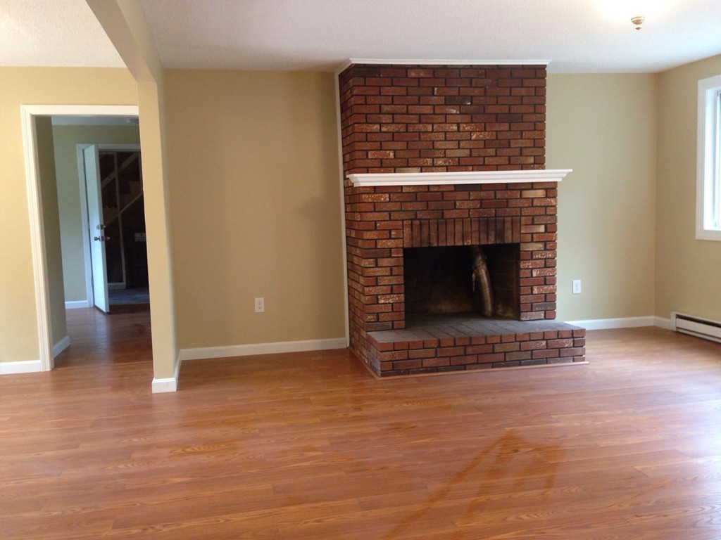 132 Benjamin Road Shirley, MA 01464 - Photo 7 of 9 a living room with a fireplace