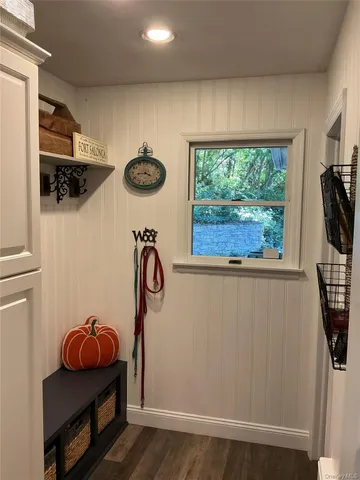 a view of entryway with wooden floor