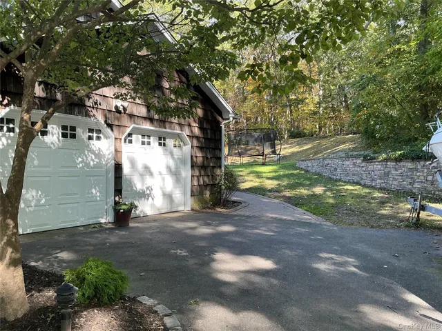 a front view of house with yard having outdoor seating