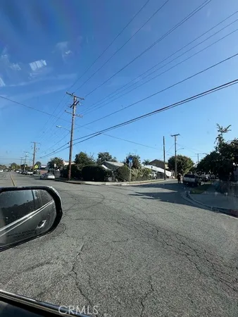 a view of a parking space and a car park side of the road