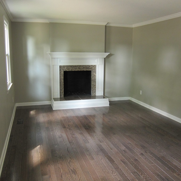 138 Endecott Street Springfield, MA 01118 - Photo 3 of 30 a view of empty room with a fireplace