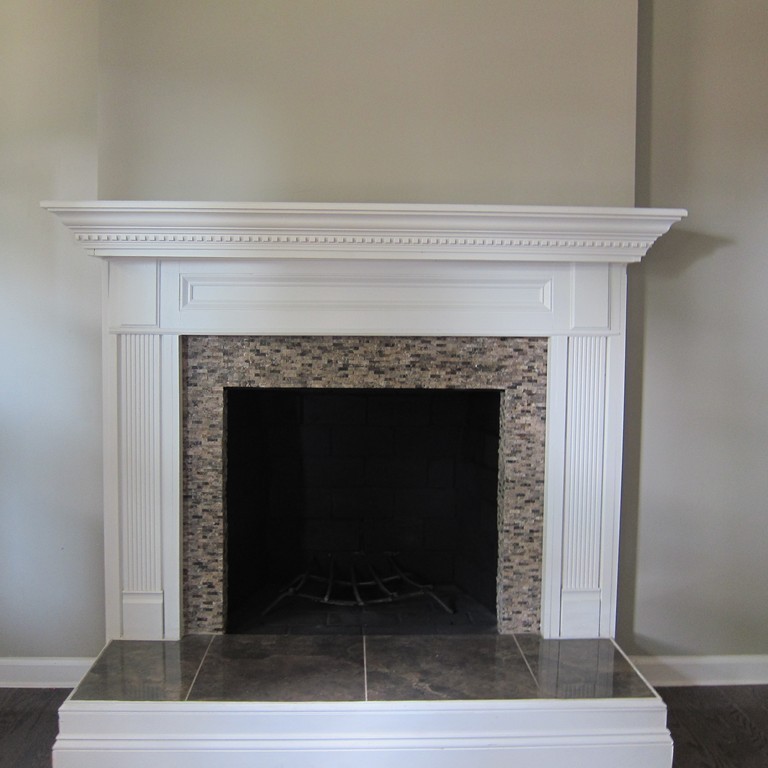 138 Endecott Street Springfield, MA 01118 - Photo 4 of 30 a living room with a fireplace