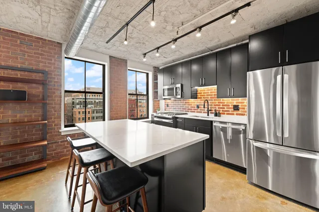 a view of kitchen center island and living room