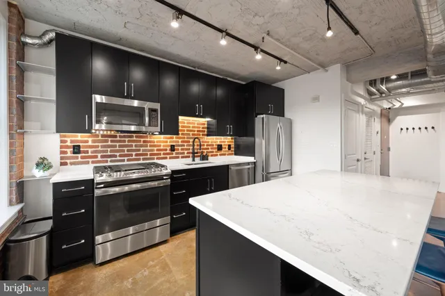 a bedroom with a large bed and a large window