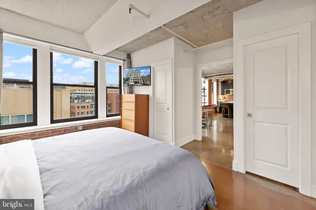 a bathroom with a toilet a sink and a mirror