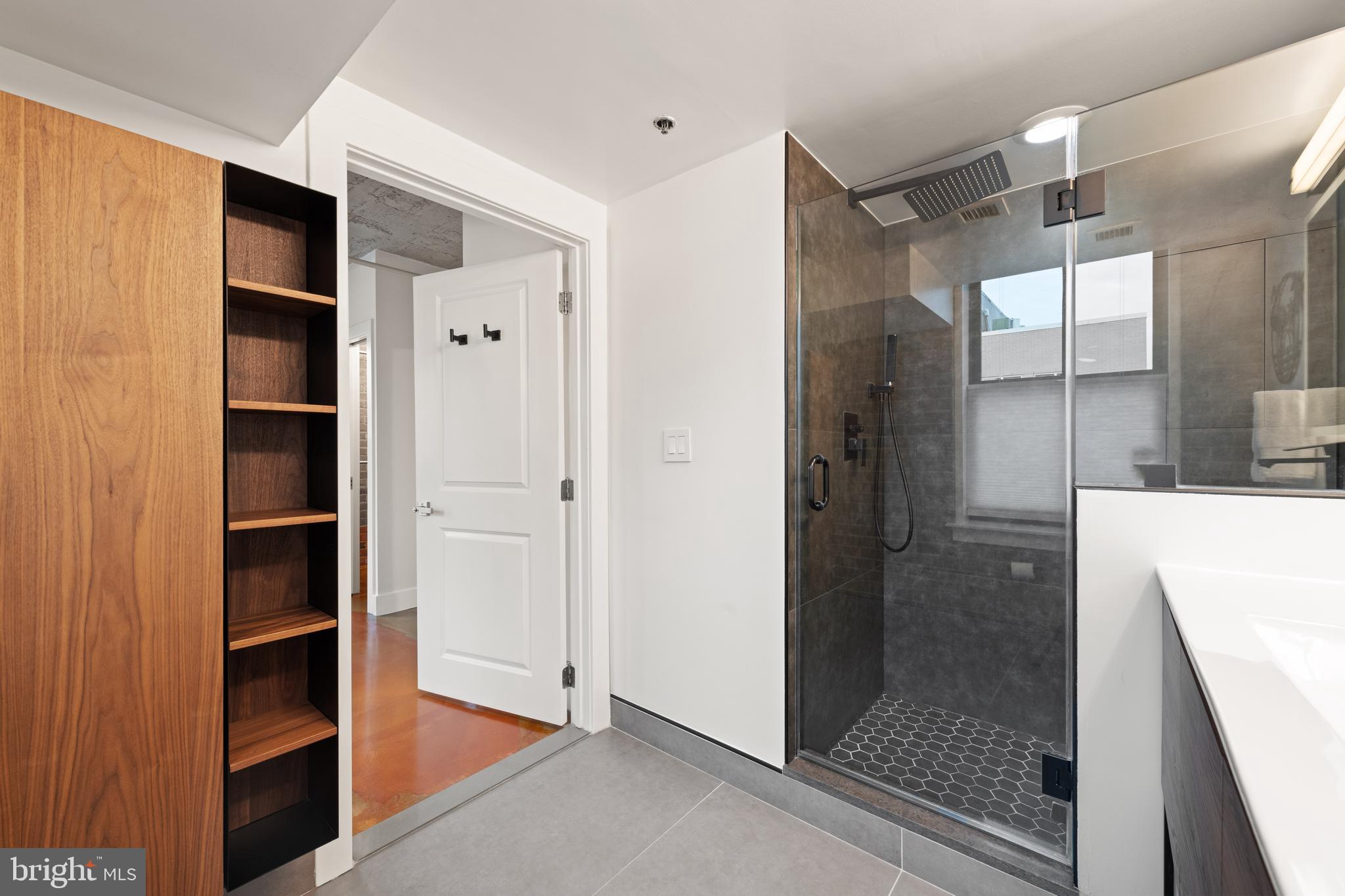916 G St. Northwest, Unit 903 Washington, DC 20001 - Photo 25 of 65 a bathroom with a shower and closet