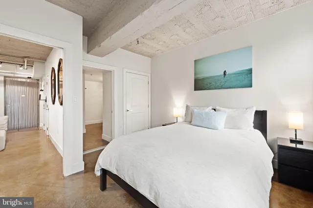 a view of a bedroom with washer and dryer