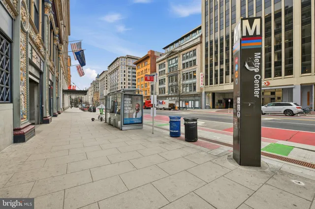 a view of a house with a yard and lake view