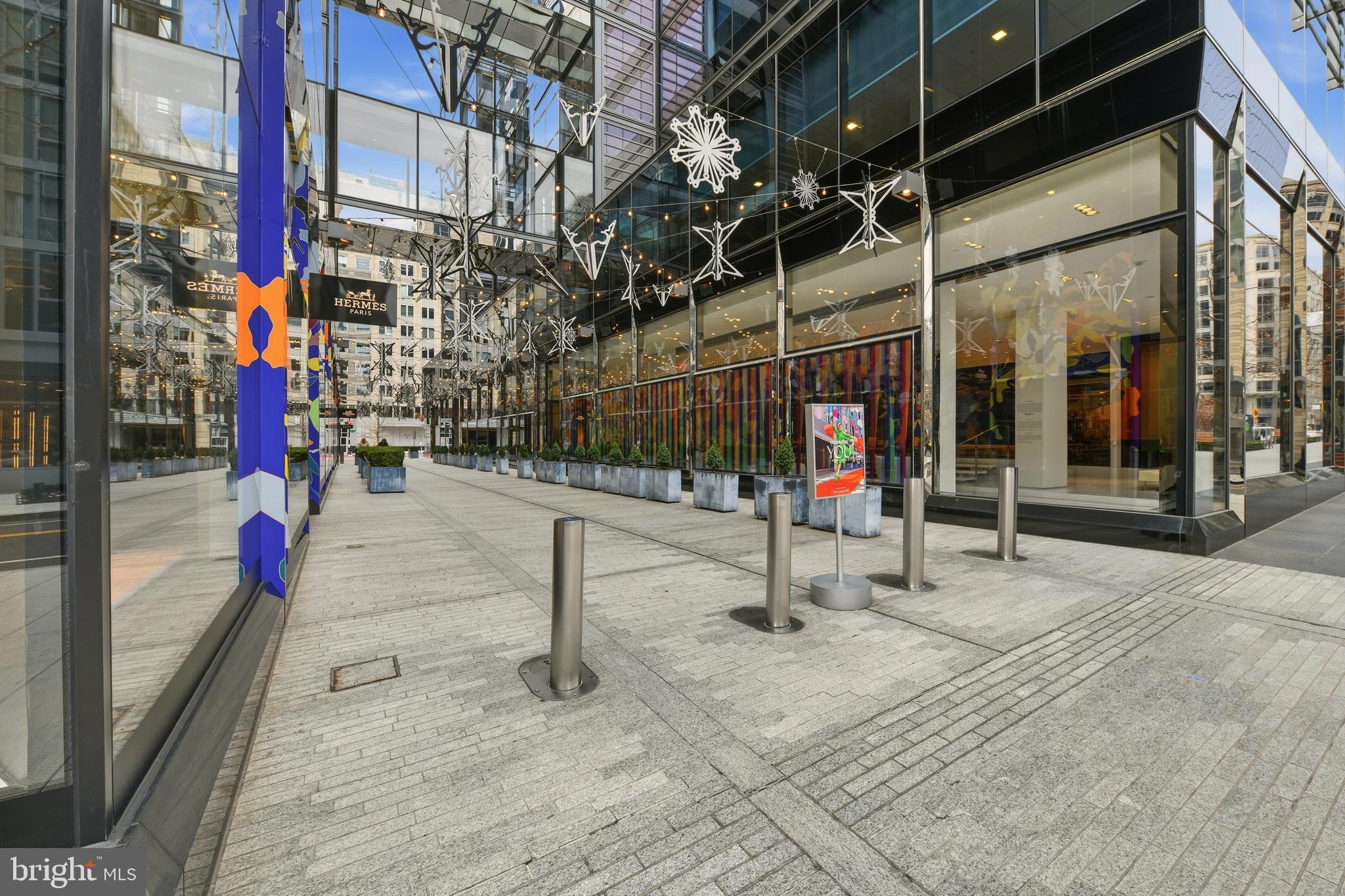 916 G St. Northwest, Unit 903 Washington, DC 20001 - Photo 53 of 65 a view of path along with retail shop and buildings