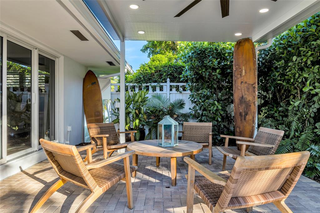 2 Mendota Lane Sea Ranch Lakes, FL 33308 - Photo 11 of 64 a view of a patio with a dining table and chairs