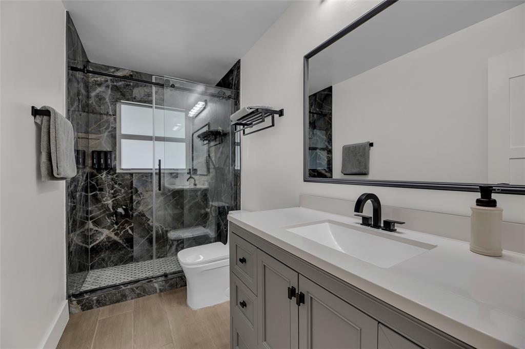 2 Mendota Lane Sea Ranch Lakes, FL 33308 - Photo 46 of 64 a bathroom with a sink toilet and shower