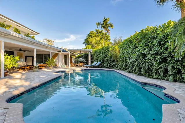 a large kitchen with stainless steel appliances lots of counter space and breakfast area