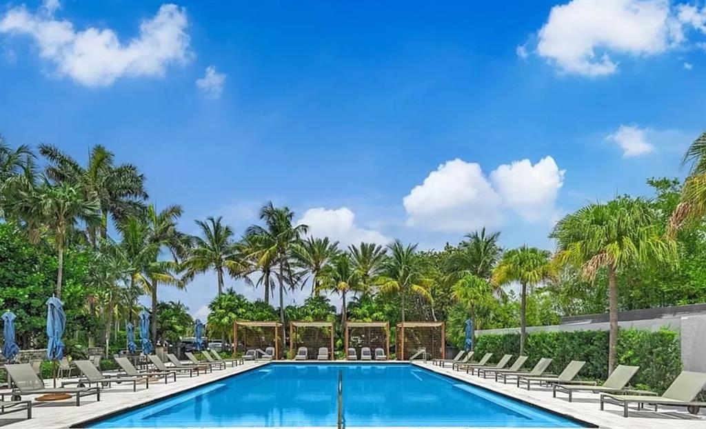 2 Mendota Lane Sea Ranch Lakes, FL 33308 - Photo 62 of 64 a view of a swimming pool with a garden