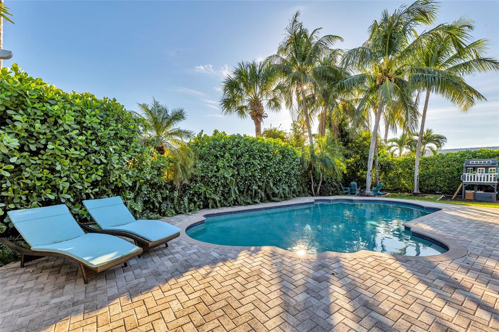2 Mendota Lane Sea Ranch Lakes, FL 33308 - Photo 9 of 64 a view of swimming pool with lounge chair