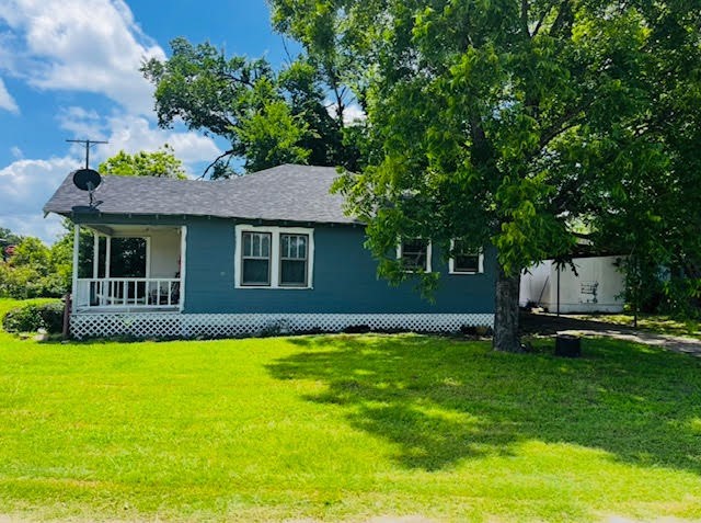 17066 Highway 36 Somerville, TX 77879 - Photo 11 of 16 a front view of a house with a yard and garage