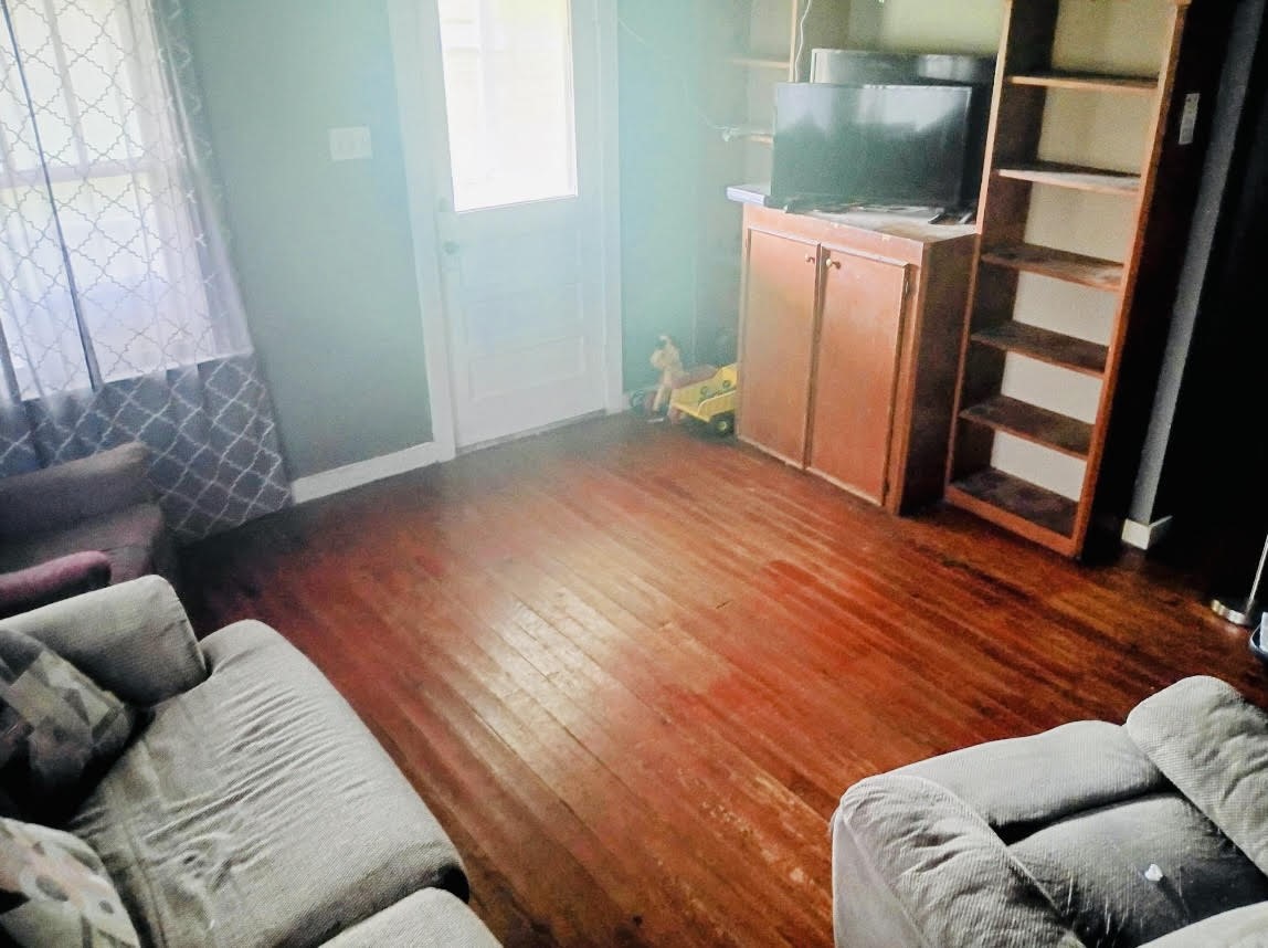 17066 Highway 36 Somerville, TX 77879 - Photo 16 of 16 a bedroom with furniture and wooden floor
