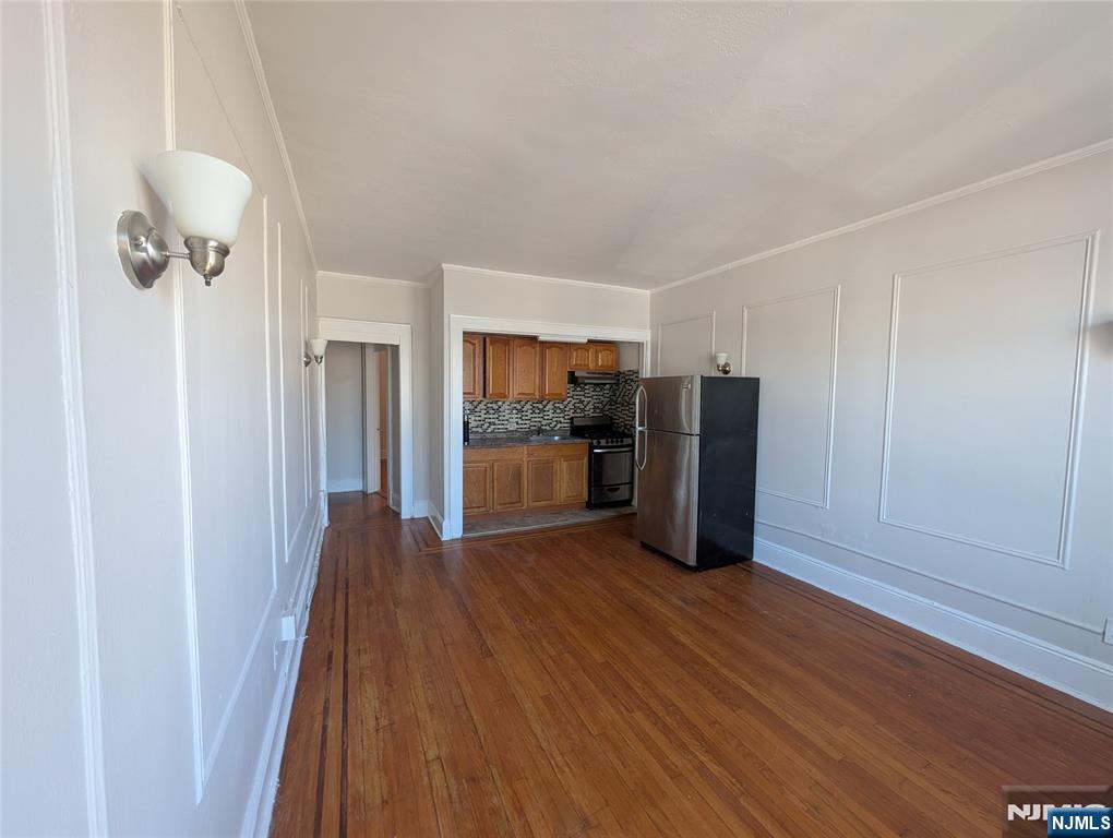 85 Anderson Street, Unit C5 Hackensack, NJ 07601 - Photo 4 of 6 a kitchen with stainless steel appliances a refrigerator and a stove top oven