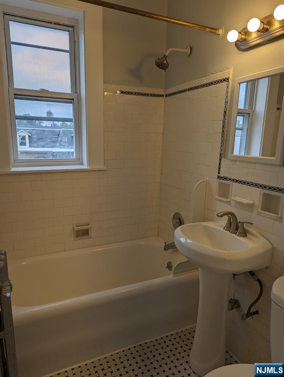 85 Anderson Street, Unit C6 Hackensack, NJ 07601 - Photo 7 of 8 a bathroom with a sink toilet and shower