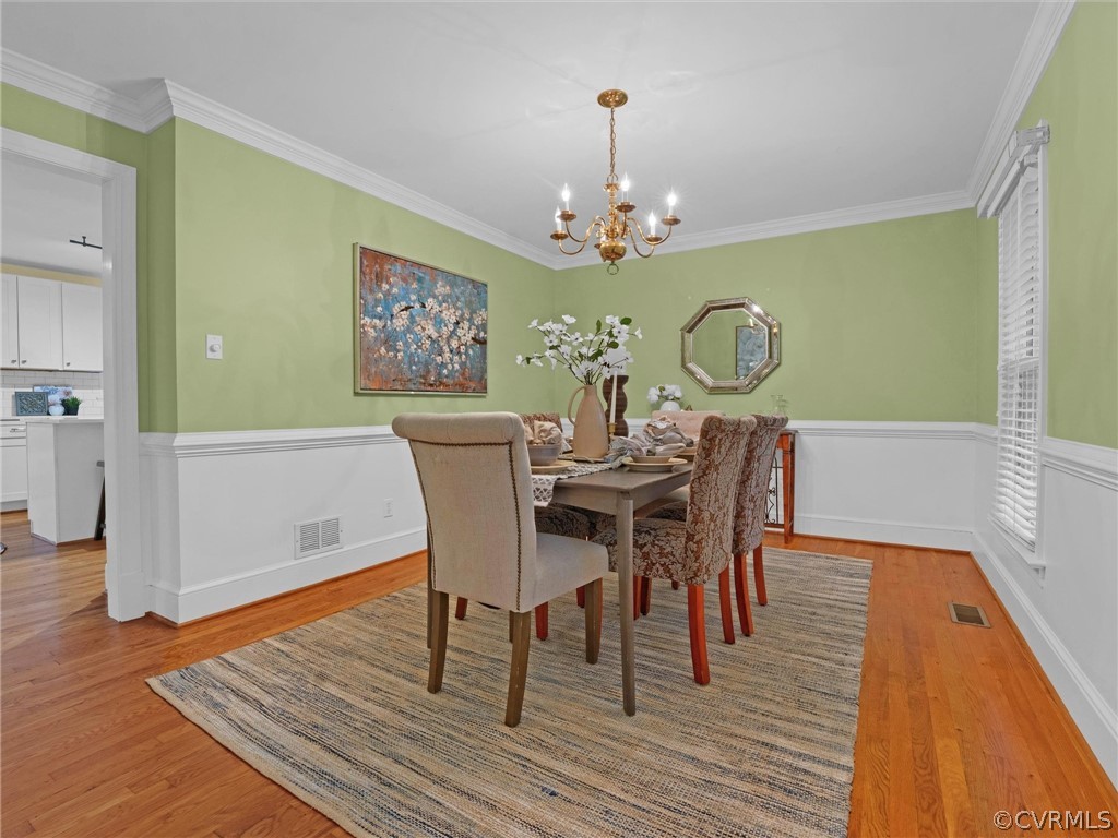 12100 2nd Branch Road Chesterfield, VA 23838 - Photo 13 of 41 a view of a dining room with furniture and wooden floor