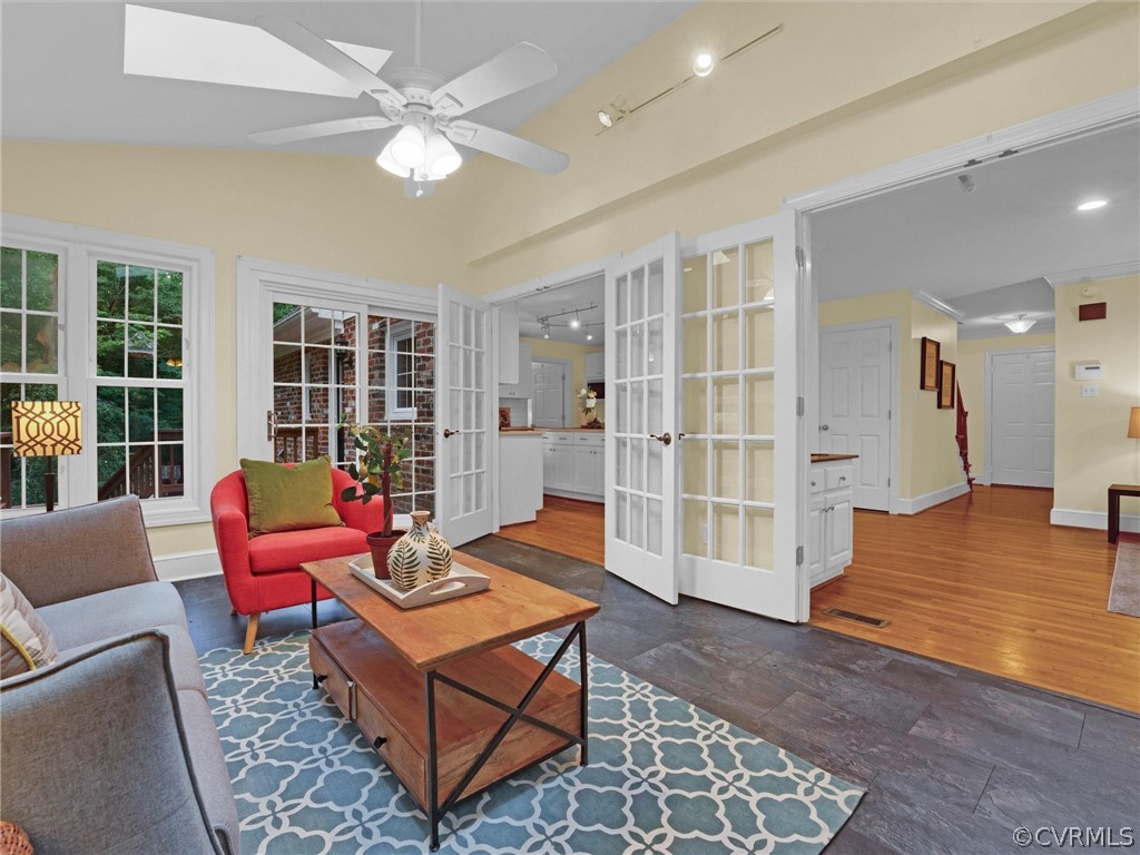 12100 2nd Branch Road Chesterfield, VA 23838 - Photo 16 of 41 a living room with furniture a rug and a chandelier