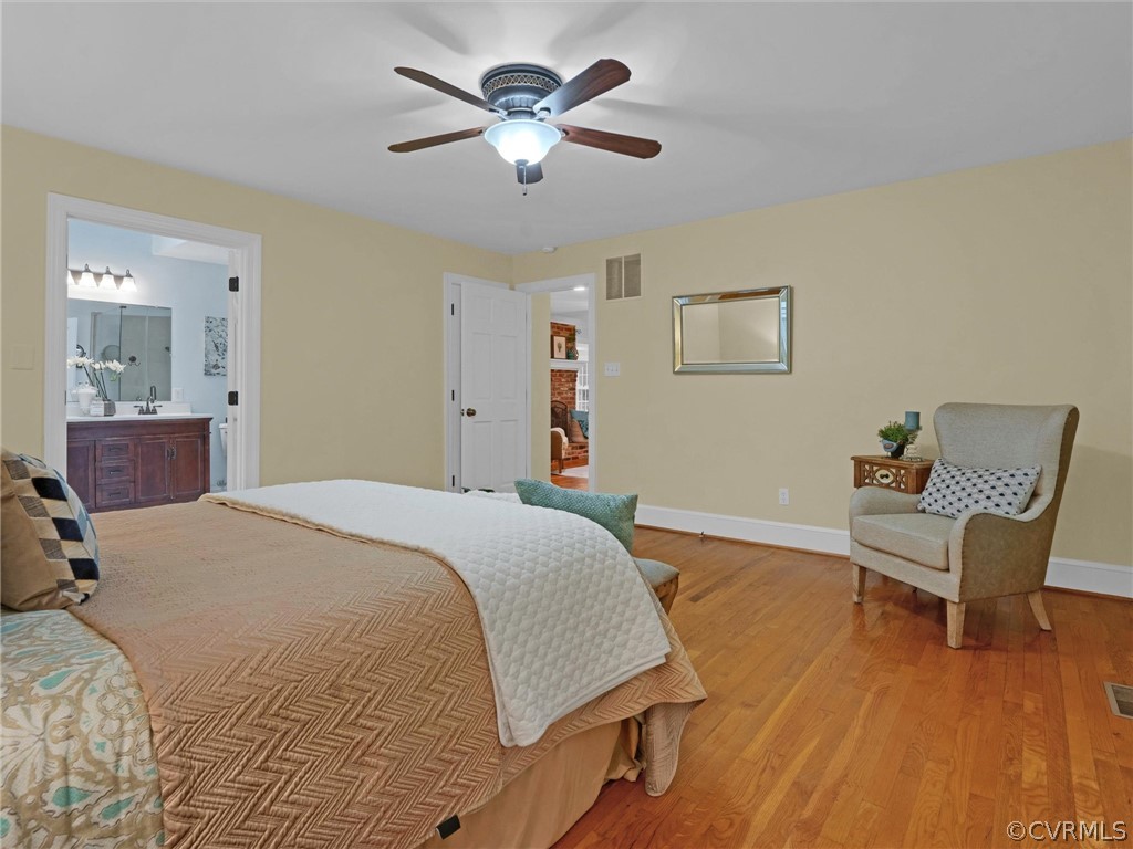 12100 2nd Branch Road Chesterfield, VA 23838 - Photo 19 of 41 a bedroom with a bed and a chandelier