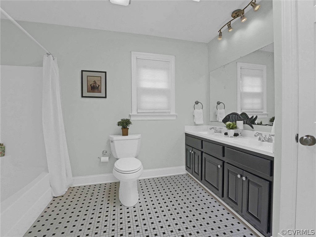 12100 2nd Branch Road Chesterfield, VA 23838 - Photo 27 of 41 a bathroom with a sink a toilet a shower and a mirror