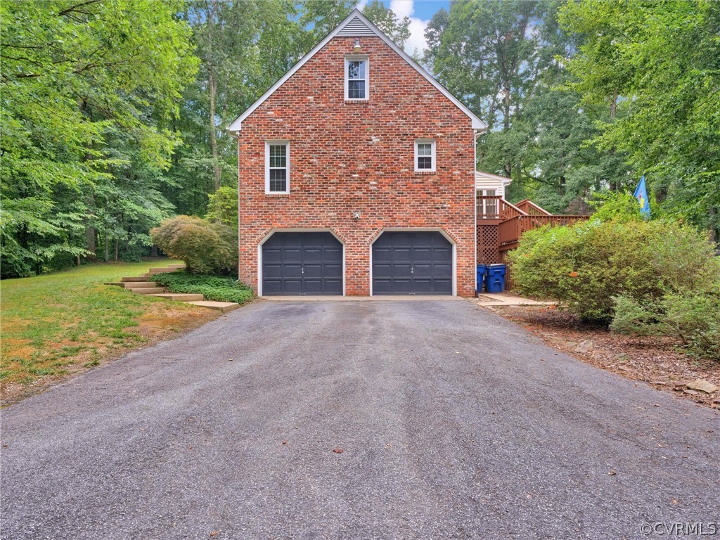 12100 2nd Branch Road Chesterfield, VA 23838 - Photo 37 of 41 a front view of a house with a yard and garage