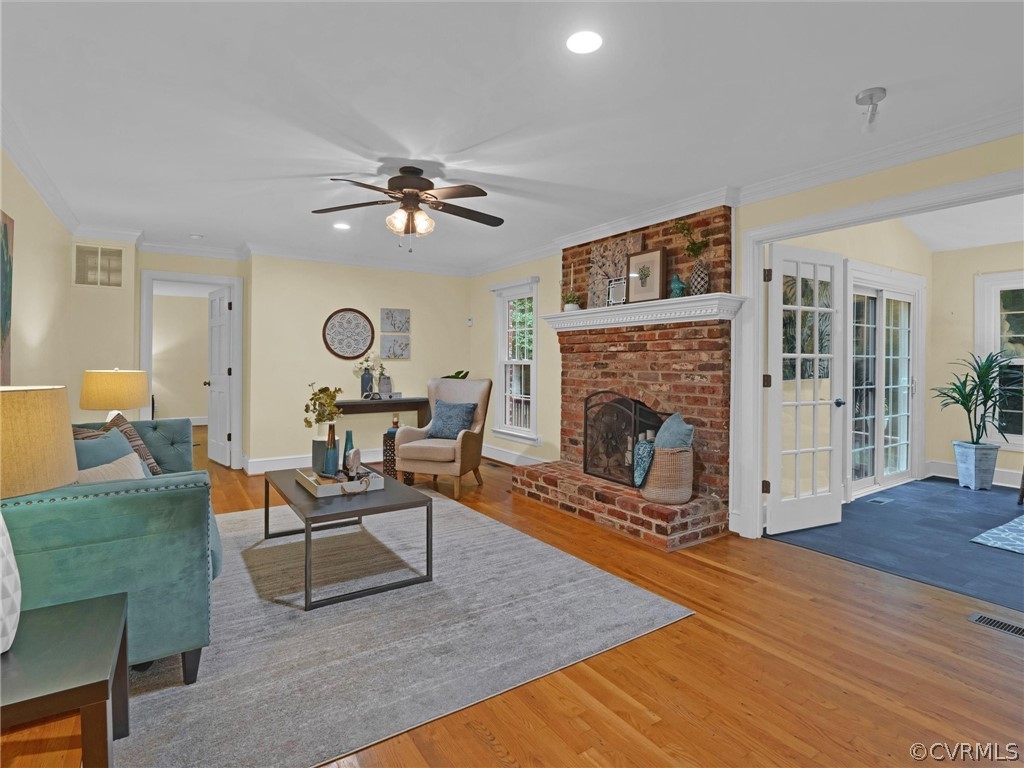 12100 2nd Branch Road Chesterfield, VA 23838 - Photo 5 of 41 a living room with furniture a fireplace and a table