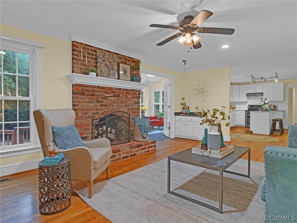 12100 2nd Branch Road Chesterfield, VA 23838 - Photo 6 of 41 a living room with furniture and a fireplace